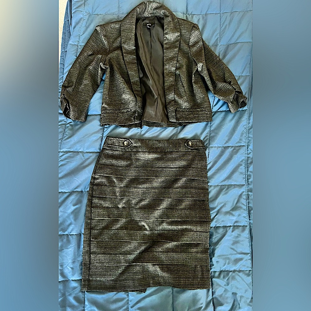 Young Lady Business Attire. Fashionable Blazer and Skirt by BCX.